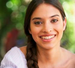Woman smiling and happy to learn about egg donor compensation