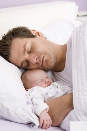 New father sleeping with his baby girl